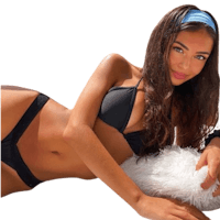 a woman in a black bikini laying on a white pillow